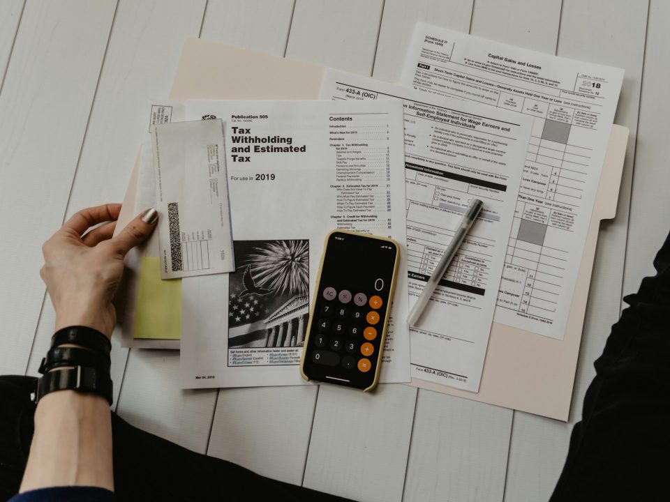 Financial statements and a calculator on a desk