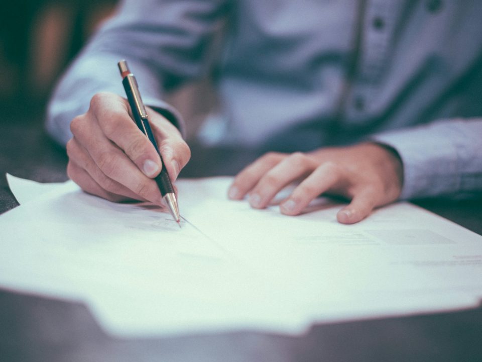 Executive signing transaction documents