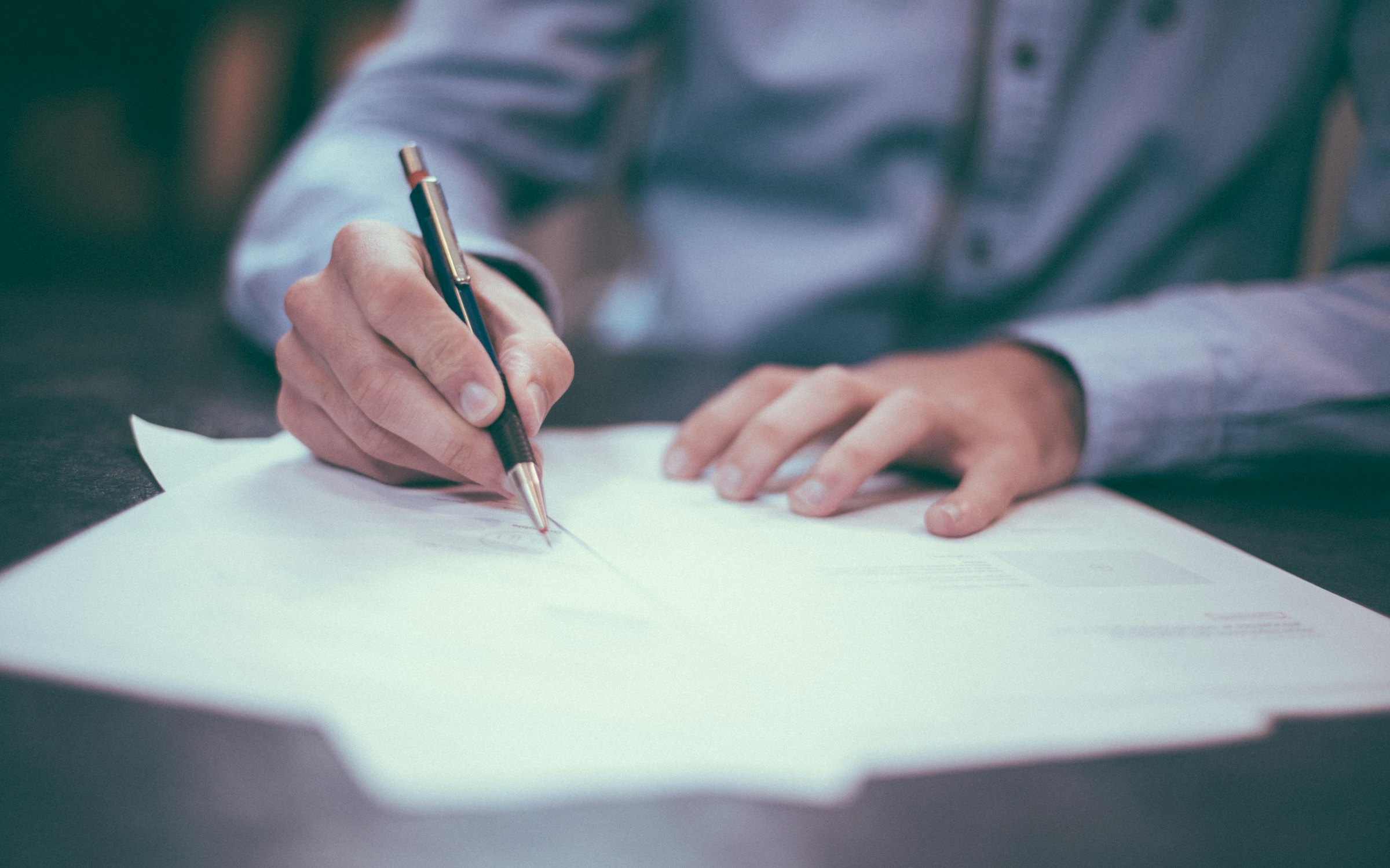 Executive signing transaction documents